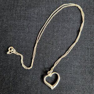 Sterling silver heart pendant with small CZ stone.